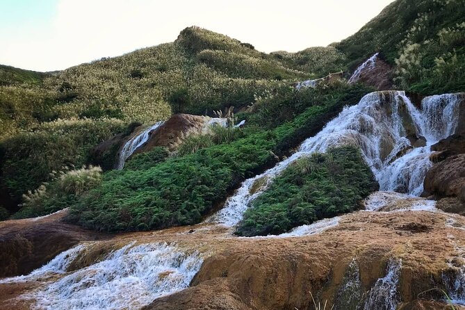 Taipei's Old Gold Rush Town: Jiufen Guided Night Tour - Golden Waterfall: a dramatic first stop